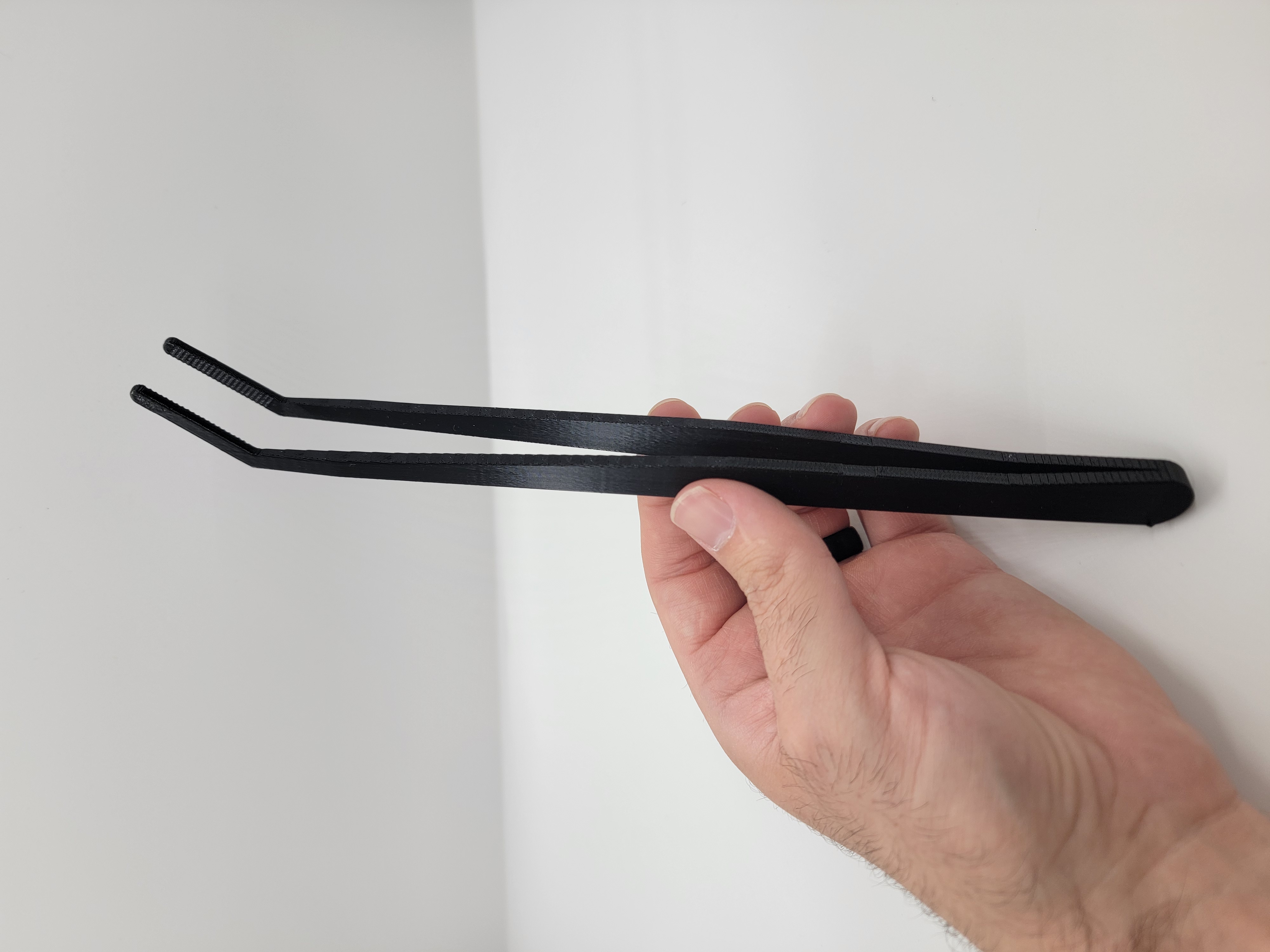 Plastic feeding tongs alternate view